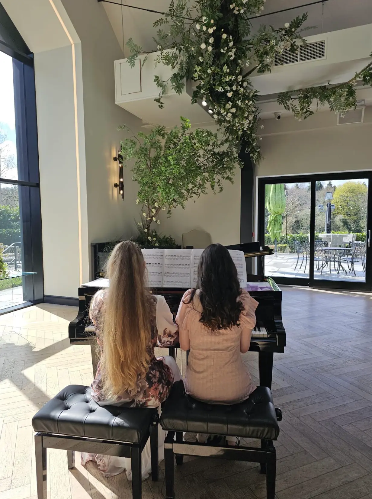 Students learning piano together